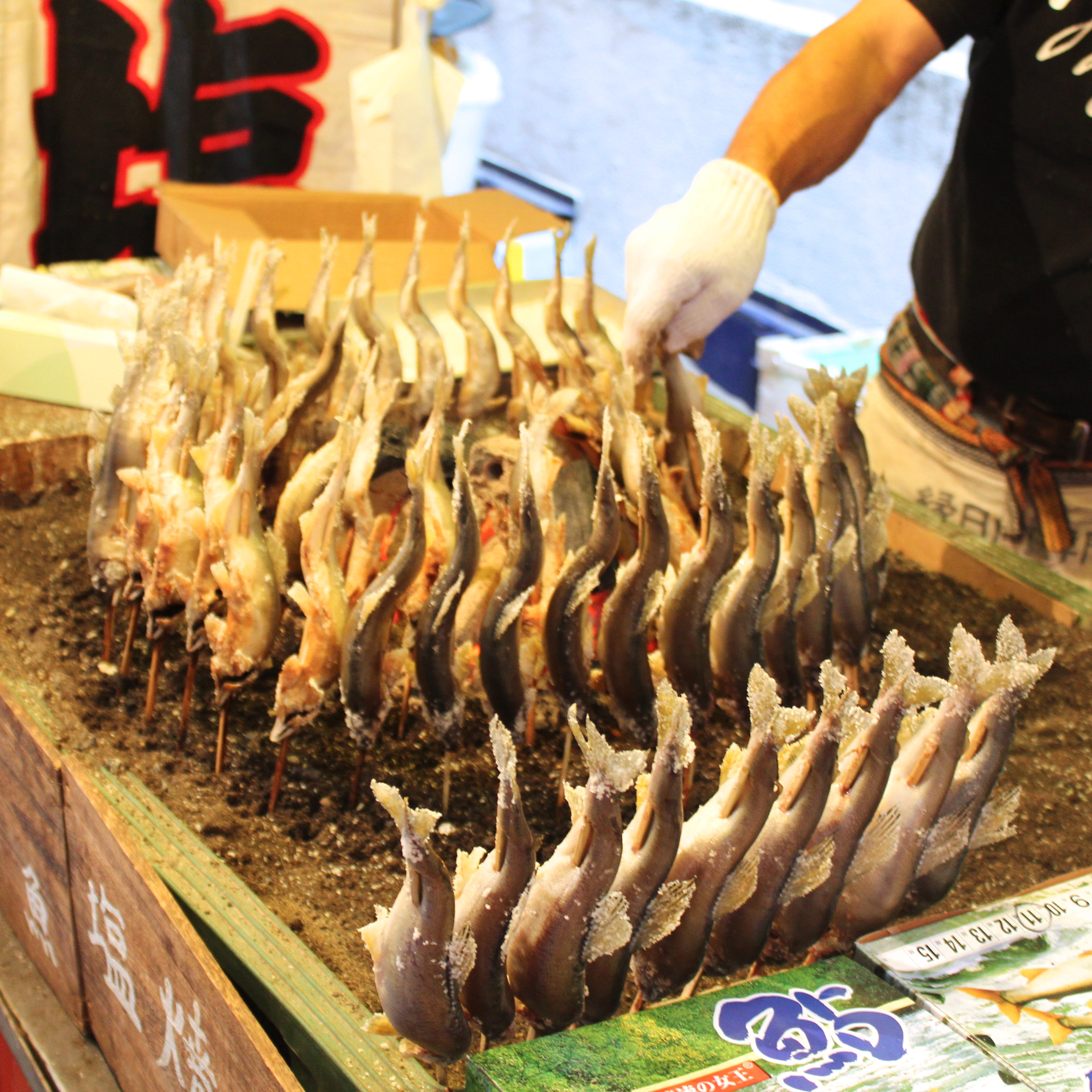 Small fish skewered and roasted.  The skin is crispy and salty while the meat is moist and tender.