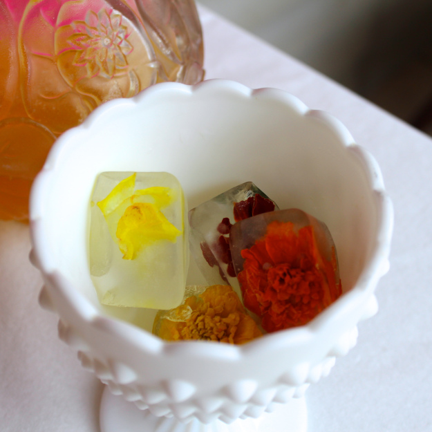Edible flowers frozen into ice cubes